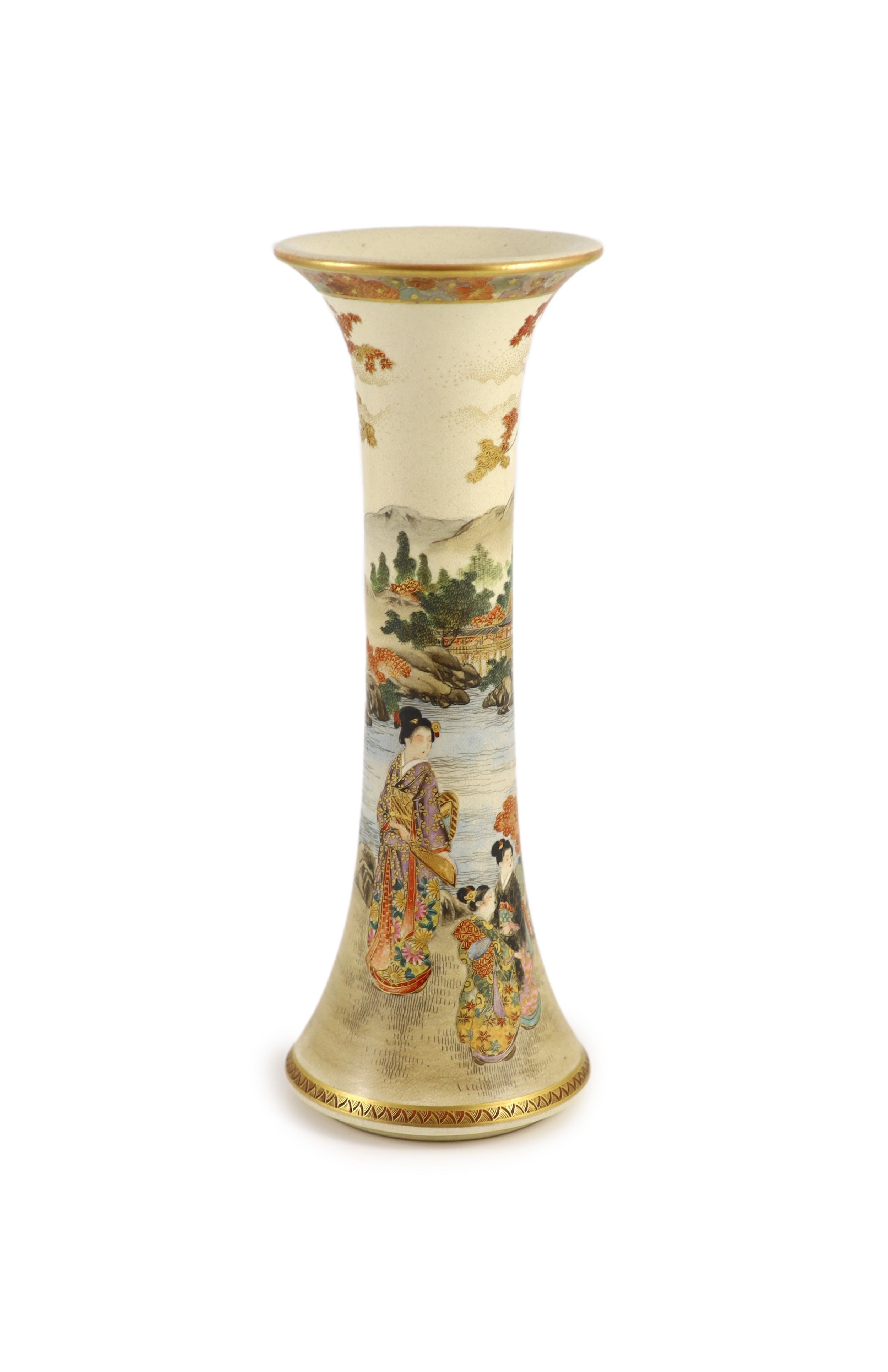 A Japanese satsuma earthenware trumpet vase by Kizan, Meiji period. The body painted and gilt with bijin and children in a lakeside landscape beneath a floral band rim, iron red and gilt signature to base. 30 cm high x 1